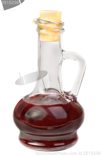 Image of Small decanter with red wine vinegar isolated on the white backg