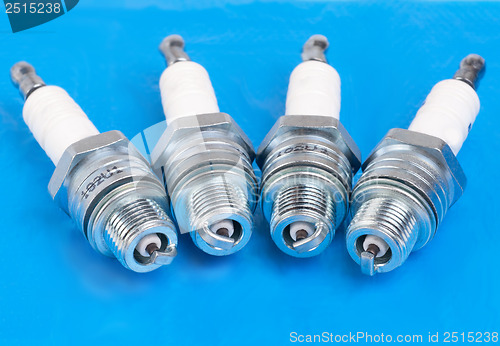 Image of spark-plug on the blue background 