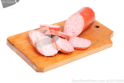 Image of salami sausage sliced on  cutting board isolated  on  white  