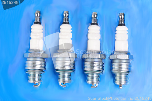 Image of spark-plug on the blue background 