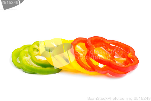 Image of red, green and yellow sliced pepper isolated on white background