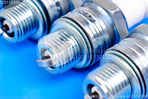 Image of spark-plug on the blue background 