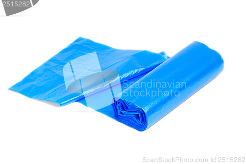 Image of roll of blue garbage bags on a white background 