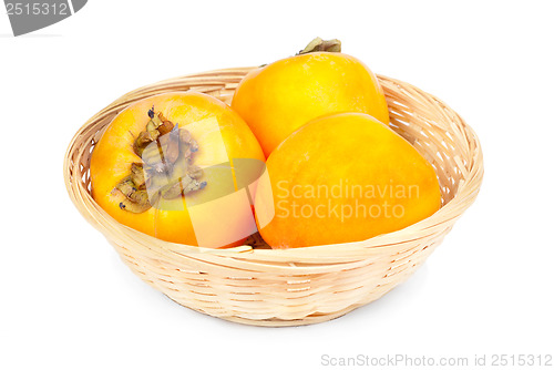 Image of Persimmon fruit in fruit basket on white background