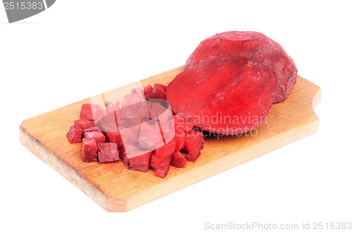 Image of Beet purple vegetable sliced on  cutting board isolated on white background 