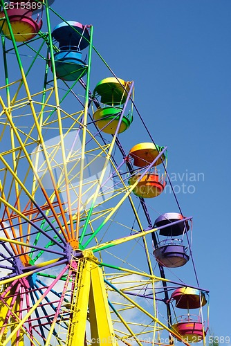 Image of Ferris wheel on the blue sky background 