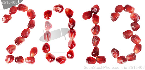 Image of Happy new year 2013. Word of 2013 from the seeds of a pomegranate isolated on white 