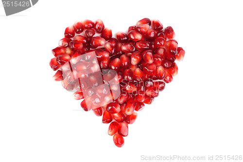 Image of pomegranate seeds as heart shaped  isolated  on  white