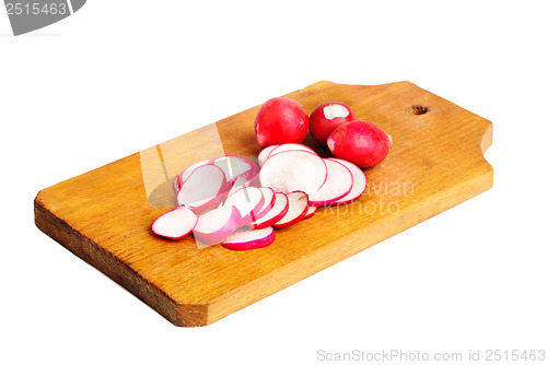 Image of Fresh slised and whole radish on  cutting board  isolated on  white
