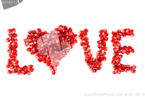 Image of word of love from the seeds of a pomegranate isolated on  white