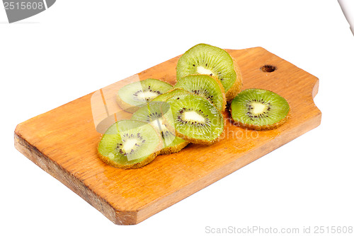 Image of slice of kiwi fruit on  cutting board isotated on a white background 