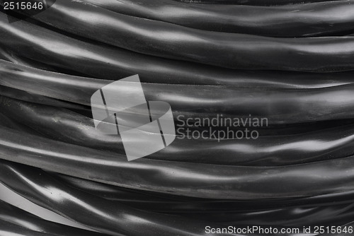 Image of black electrical cable as industrial background   