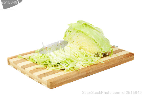 Image of Green cabbage sliced on cutting board isolated  on  white