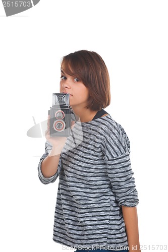 Image of Lovely teenage girl with retro photo camera