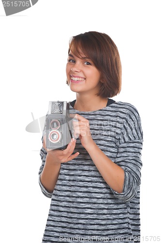 Image of Lovely teenage girl with retro photo camera