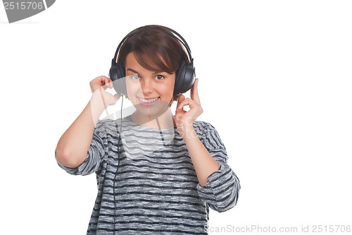 Image of Pretty young girl listening music