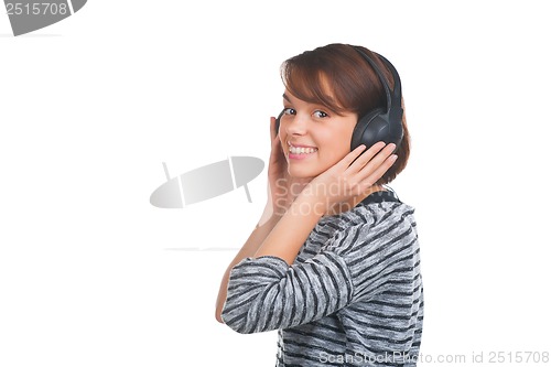 Image of Pretty young girl listening music