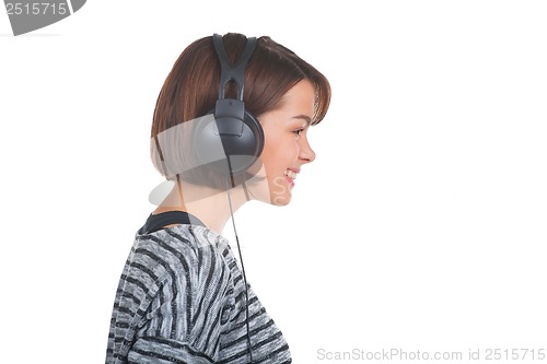 Image of Pretty young girl listening music