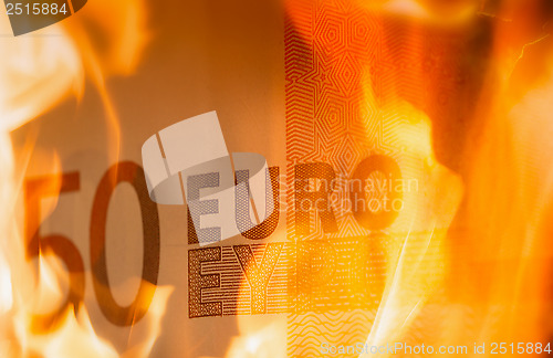 Image of 	euro banknotes burning