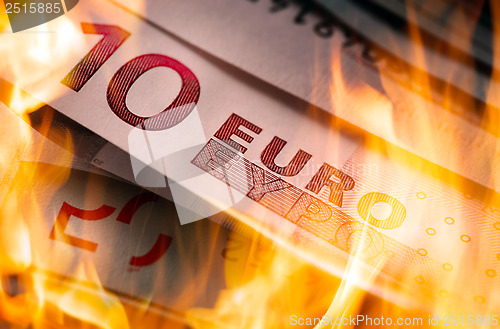 Image of euro banknotes burning 