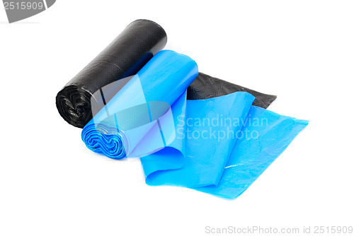 Image of roll of blue and  black garbage bags on a white background 