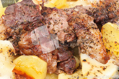 Image of Barbecue meat with potato close-up as food background 