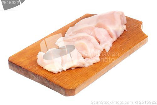 Image of chicken meat sliced   on  cutting  board isolated  on  white  background