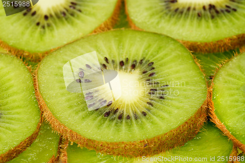 Image of slices of kiwi fruit background