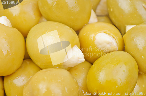 Image of Green olives stuffed with almonds  as  food  background