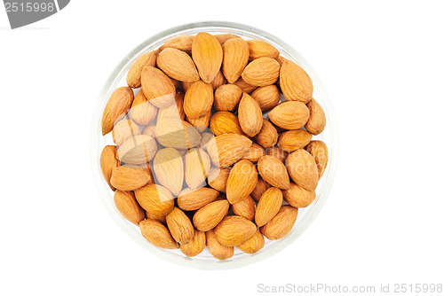 Image of Dried almonds on glass bowl isolated on a white background 