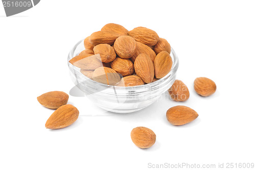 Image of Dried almonds on glass bowl isolated on a white background 