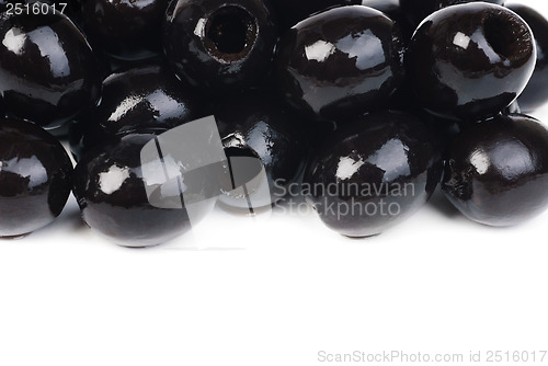 Image of Black pitted olives isolated on white 