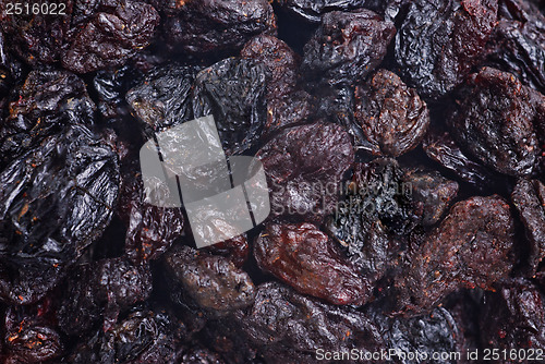 Image of dark dried raisins  close- up food background 