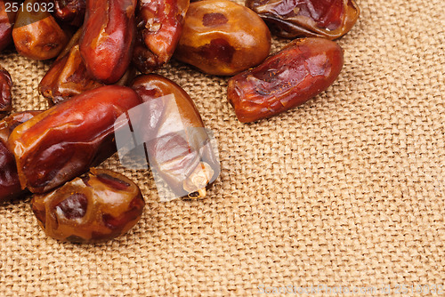 Image of dried dates on canvas background