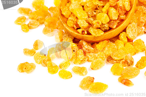 Image of Golden raisins close- up and wooden spoon, isolated on white background 