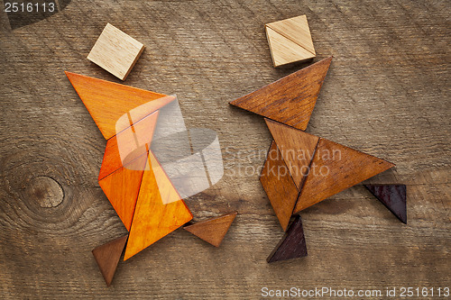 Image of dancing tangram figures