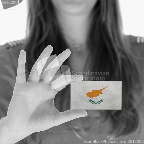 Image of Woman showing a business card