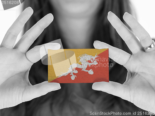 Image of Woman showing a business card