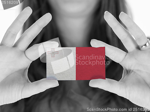 Image of Woman showing a business card