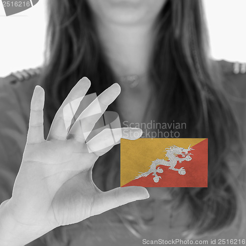 Image of Woman showing a business card