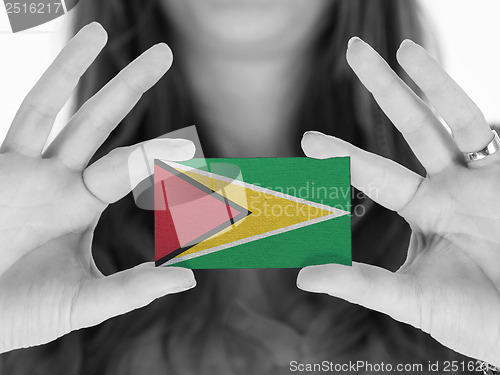 Image of Woman showing a business card