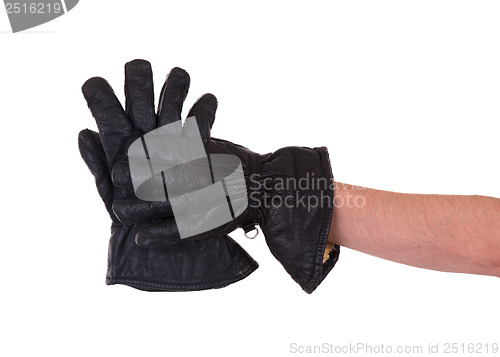 Image of Mans hand in very old black leather glove