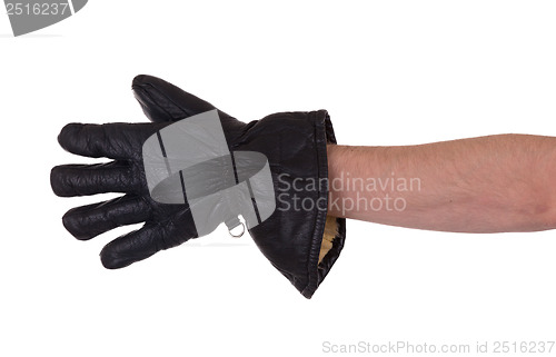 Image of Mans hand in very old black leather glove