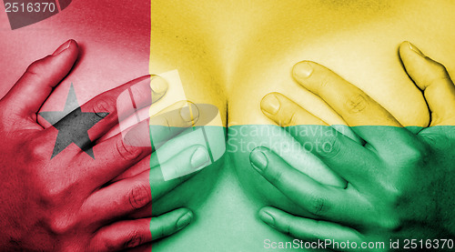 Image of Hands covering breasts