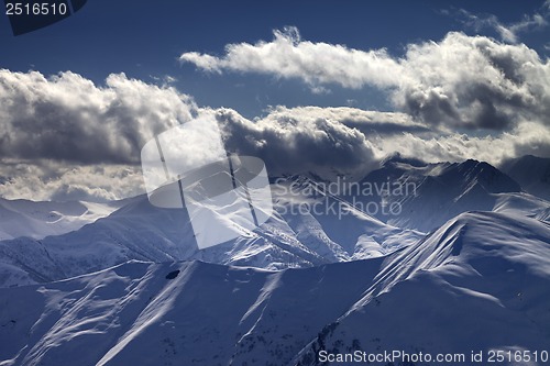 Image of Evening mountains in sunlight clouds