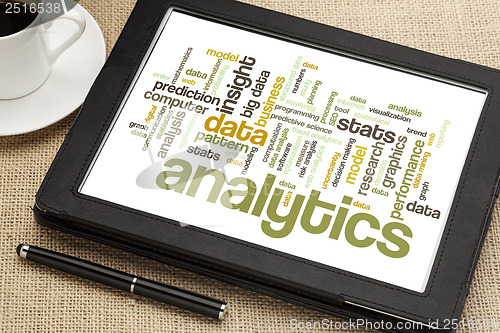 Image of analytics word cloud on digital tablet