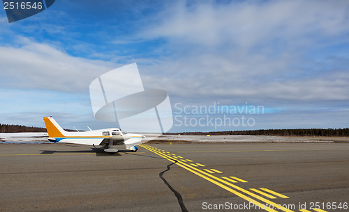 Image of Small airplane in a small airport