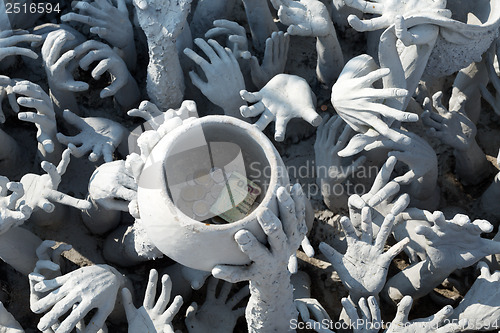 Image of Sculptural composition with his hands and cup