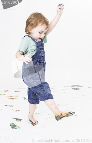 Image of young child with paint on feet