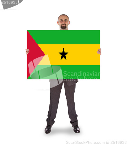 Image of Smiling businessman holding a big card or flag